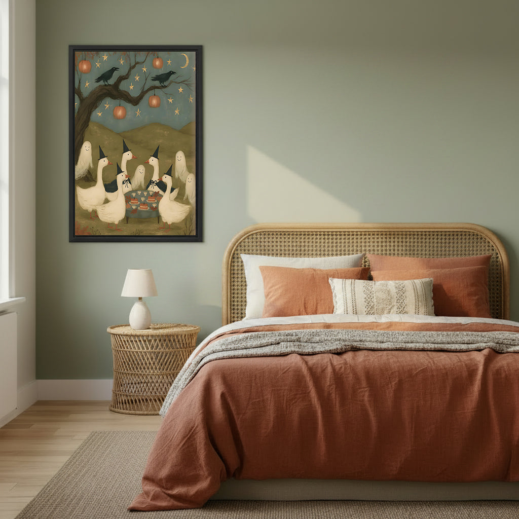 Halloween witch geese party folk art six white geese black witch hats pumpkin lantern crow bare tree black framed canvas wall art on sage green wall above wide rattan arched headboard bed with terracotta linen