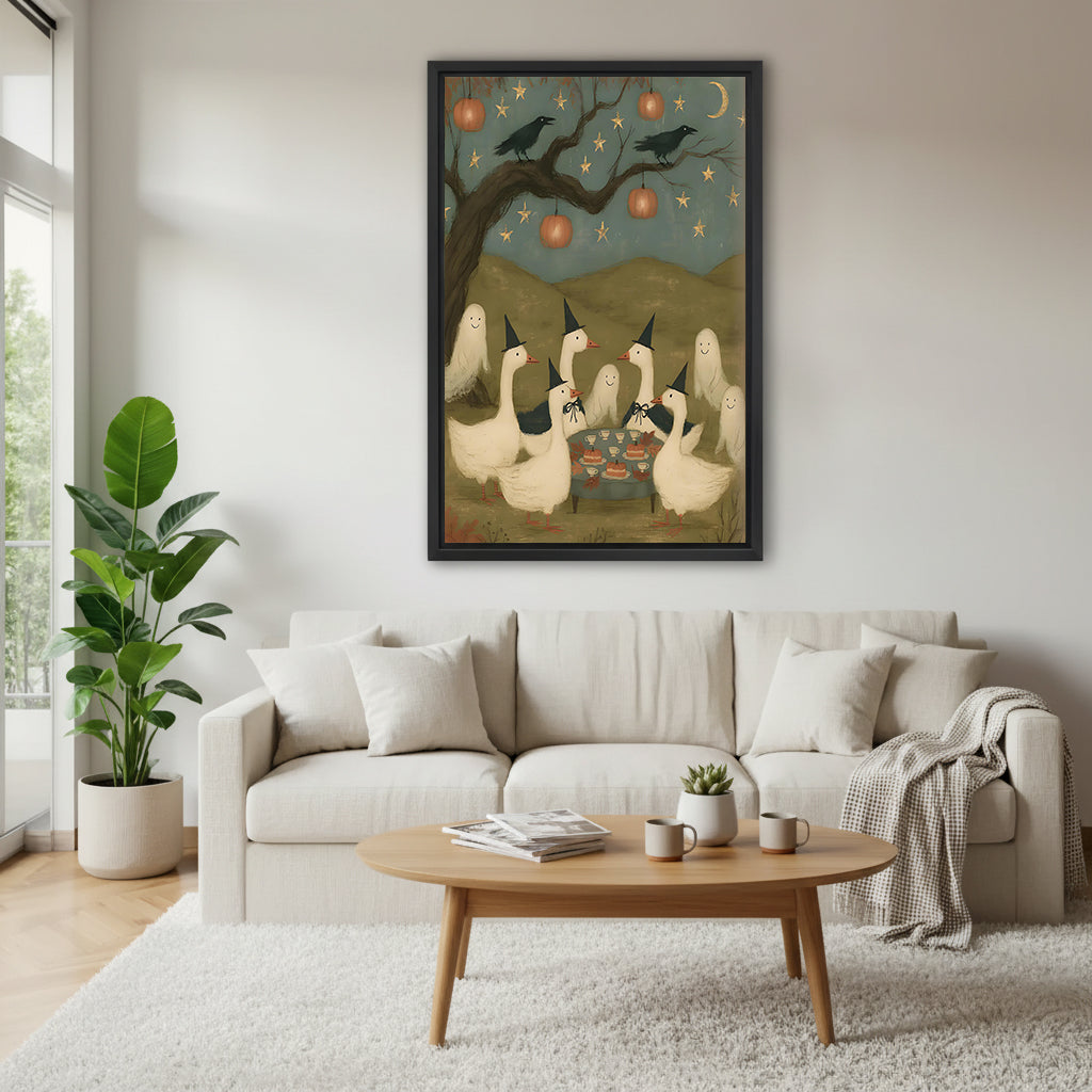 Halloween witch geese party folk art six white geese witch hats pumpkin lantern crow star sky black framed canvas wall art above wide cream linen sofa with oval wood coffee table succulent and gray knit throw