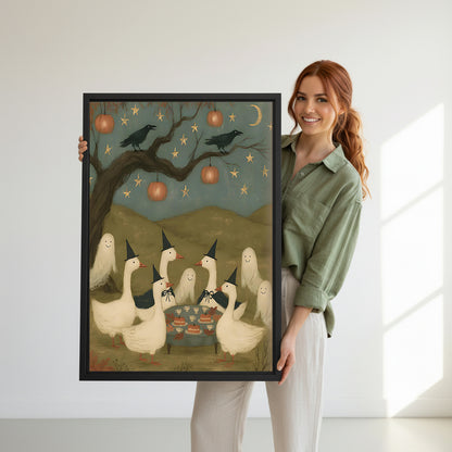 Smiling redhead woman holding large Halloween witch geese party folk art six white geese black witch hats crows pumpkin lanterns black framed canvas wall art size reference in bright white room
