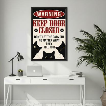 Warning keep door closed don't let the cats out retro sign wall art print in black frame above white desk with laptop and succulent in home office