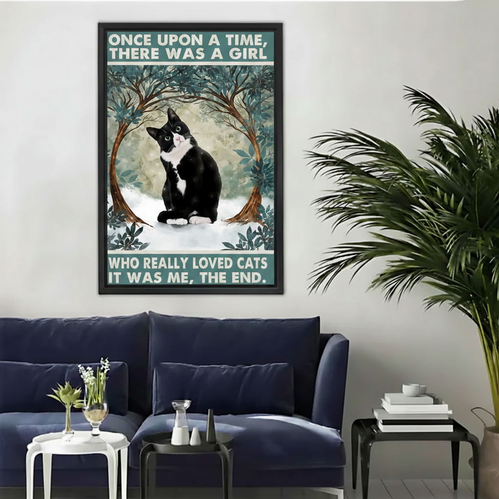 Once upon a time there was a girl who loved cats wall art print in black frame above navy blue sofa with white geometric side table in modern living room