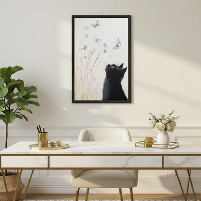 Serene black cat and blue butterflies wildflower watercolor wall art print in black frame above marble gold-leg desk with white roses in elegant home office