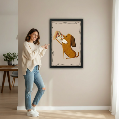 Woman pointing at framed dachshund eating pizza art print showing actual print size in bright minimalist hallway