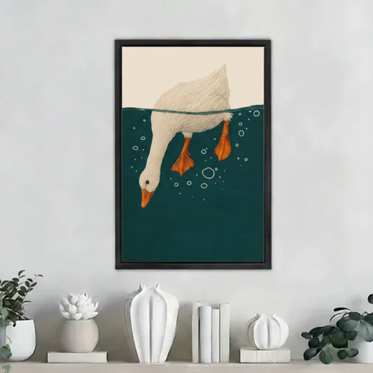 Whimsical diving goose wall art print in black frame on white shelf with ceramic vases in modern minimalist home decor