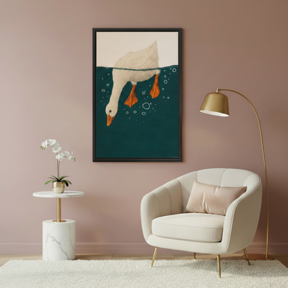 Funny diving goose illustration wall art in black frame on dusty pink wall above velvet armchair with marble side table
