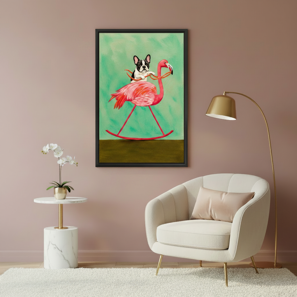 Whimsical French bulldog riding pink flamingo oil painting wall art in black frame on dusty pink wall above cream velvet armchair with gold arc floor lamp
