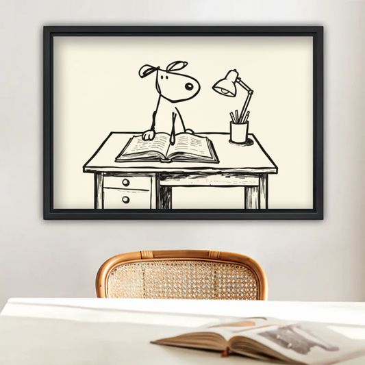 Minimalist dog reading book line art print in black frame above white dining table with rattan chair in cozy home decor
