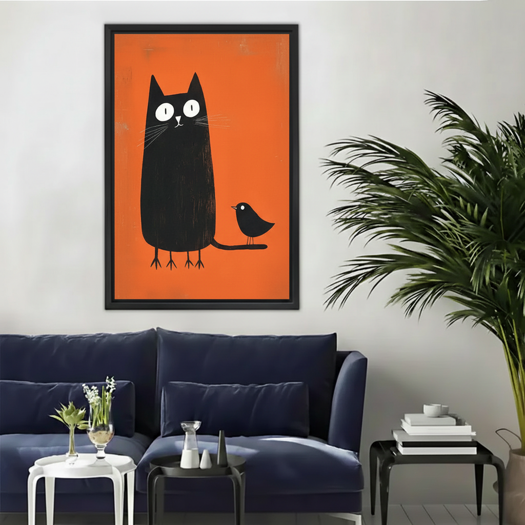 Whimsical black cat and bird orange background wall art print in black frame above navy blue velvet sofa in modern eclectic living room