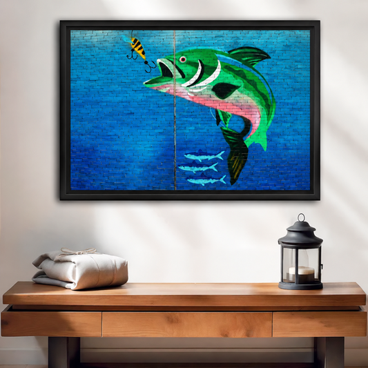 Bass fishing canvas wall art in a black frame hangs above a wooden console with rustic accessories.