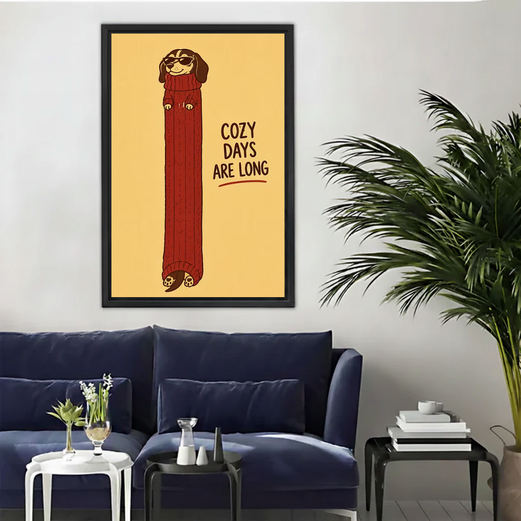 Whimsical cozy dachshund canvas wall art above a navy sofa beside a tall indoor palm.