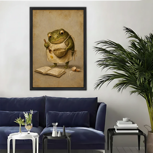 Vintage baking frog canvas wall art above a navy sofa beside a tall indoor palm.