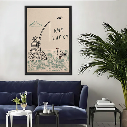 Minimalist fishing humor canvas wall art above a navy sofa beside a tall indoor palm.