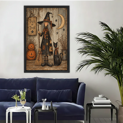 Vintage witch cat canvas wall art framed above a navy sofa beside a tall indoor palm.