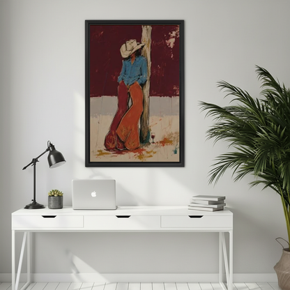 Rustic cowboy rest canvas wall art framed above a white desk with a laptop and black lamp.