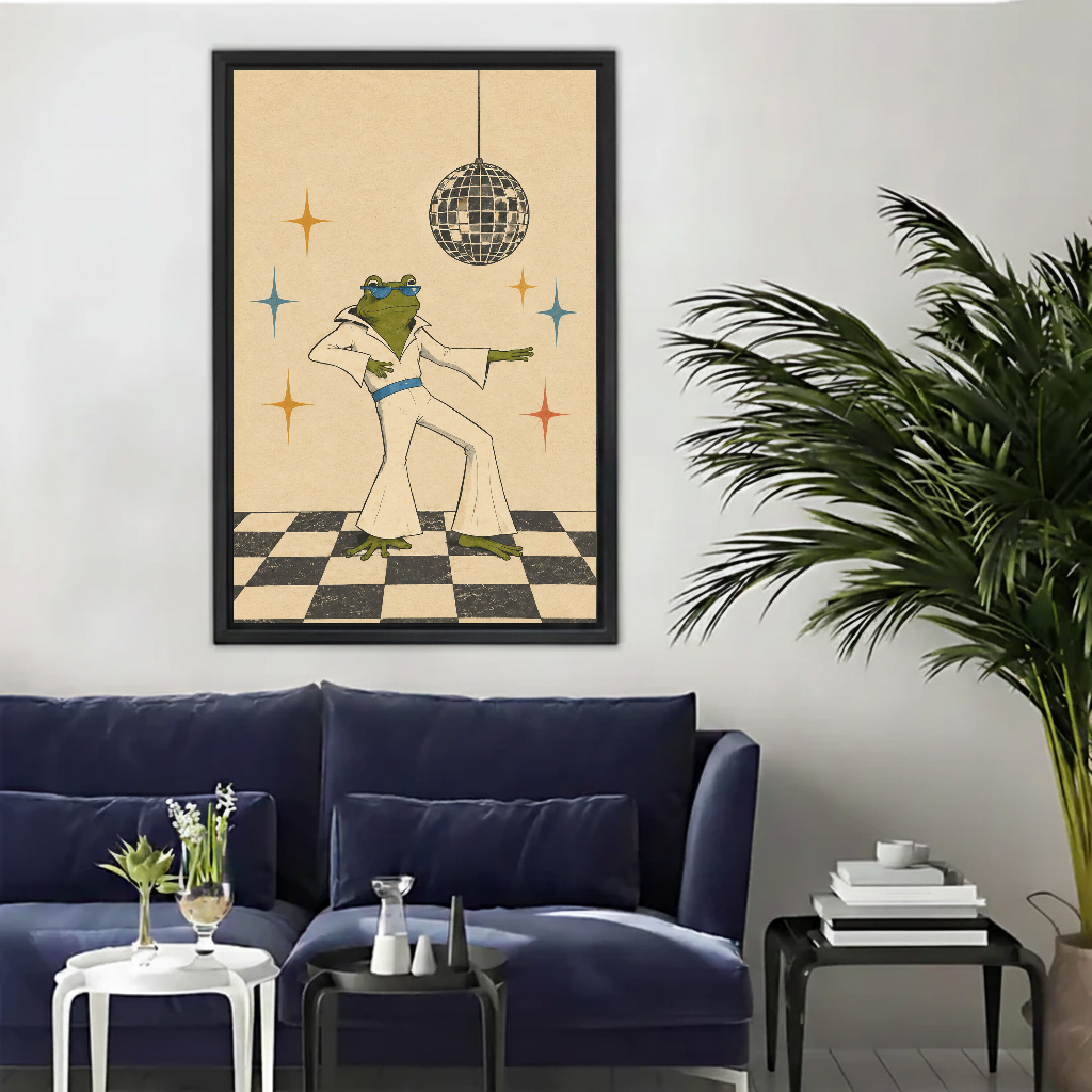 Retro dancing frog canvas wall art framed above a navy sofa beside a tall indoor palm.