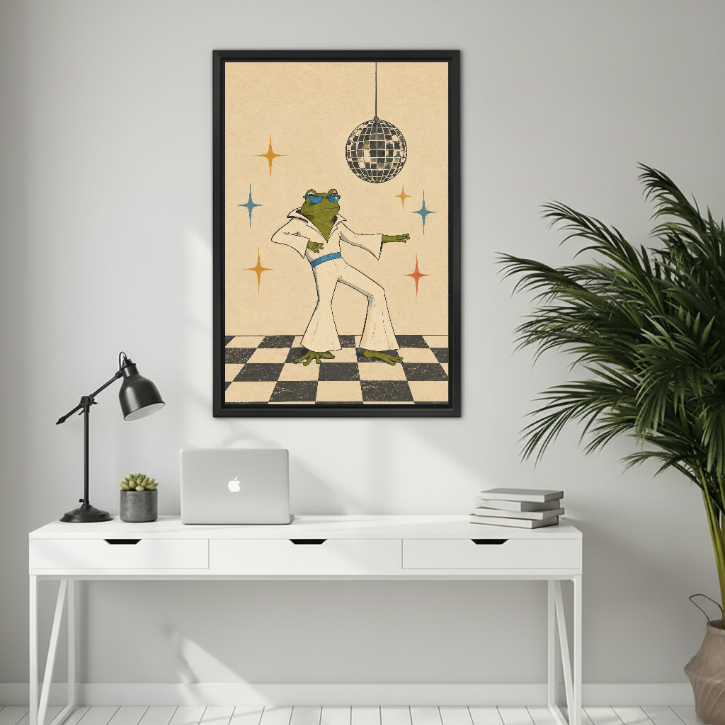 Retro dancing frog canvas wall art framed above a white desk with a laptop and black lamp.