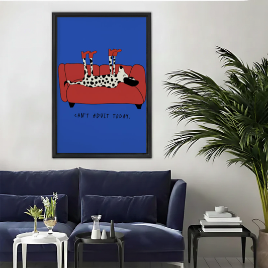 Lazy dog sofa canvas wall art framed above a navy sofa beside a tall indoor palm.