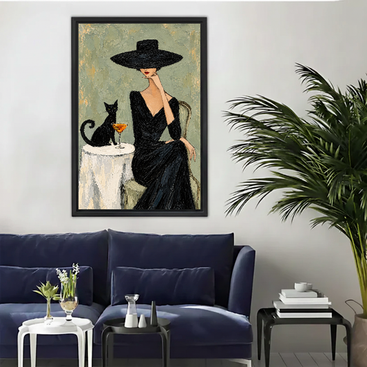 Elegant woman cat canvas wall art framed above a navy sofa beside a tall indoor palm.