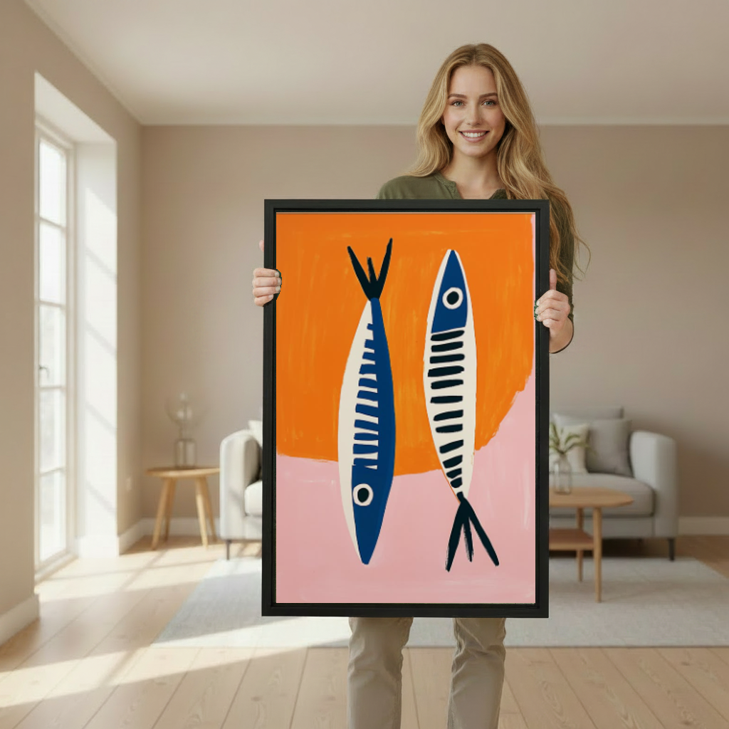 Modern blue fish canvas wall art framed as a woman holds the artwork in a softly lit room.