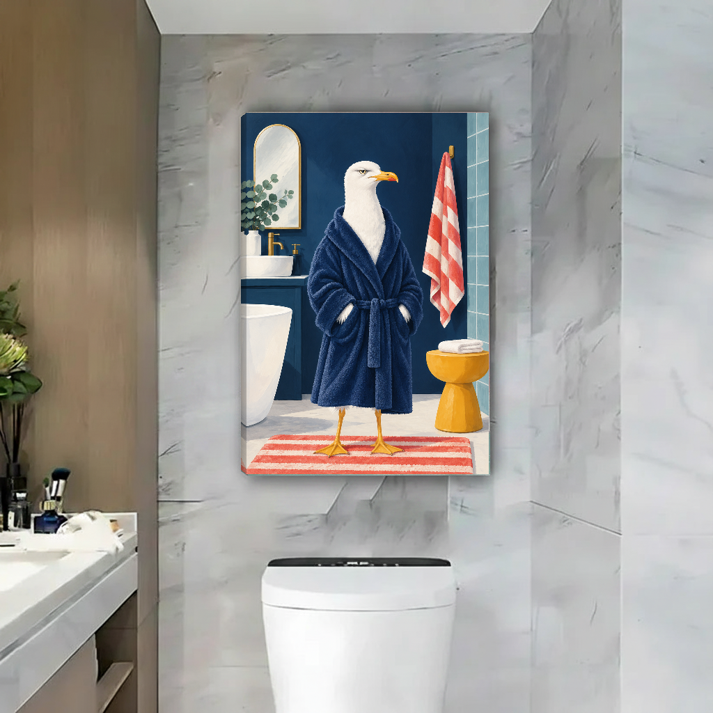Funny bathrobe seagull canvas wall art unframed above a toilet with pale marble walls and a nearby basin.