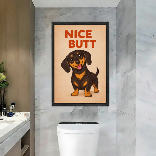 Nice butt dachshund canvas wall art framed above a toilet against pale marble bathroom tiles.