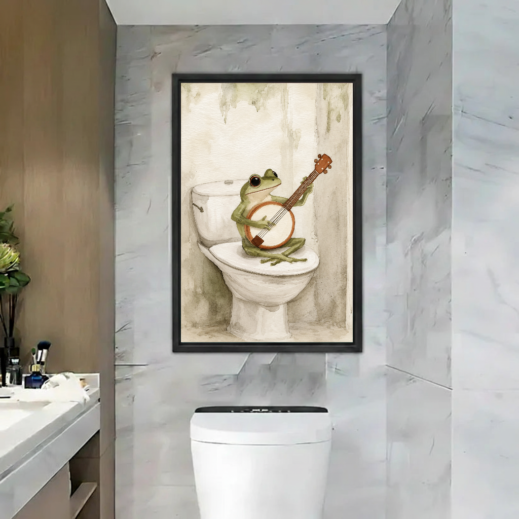 Banjo frog canvas wall art in a black frame above a toilet against marble walls.