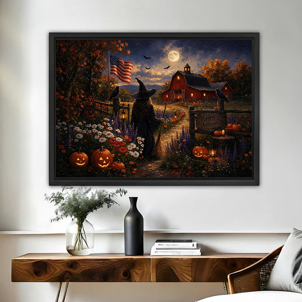 Moonlit Halloween Farm artwork in a black frame above a live-edge wooden desk.