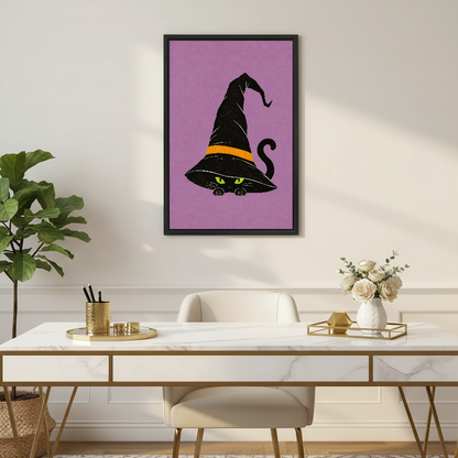 Whimsical Witch Hat Cat artwork in a black frame above a white desk with gold accents.