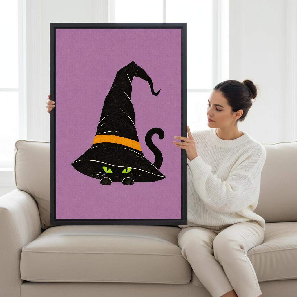 Whimsical Witch Hat Cat artwork displayed beside a seated woman in a neutral interior.