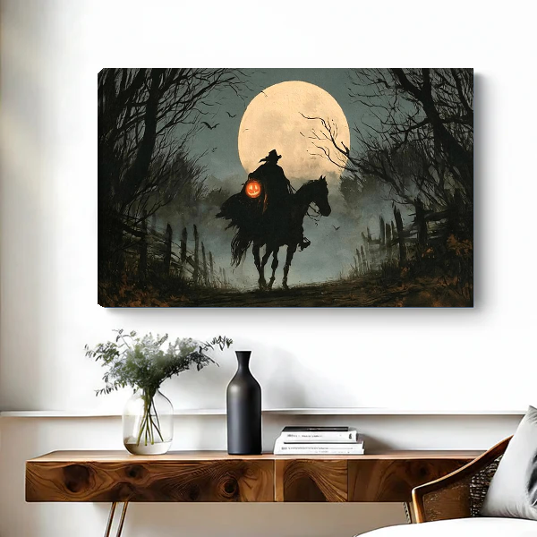 Gothic Moonlit Witch Rider artwork as unframed canvas above a wooden desk with black vase.
