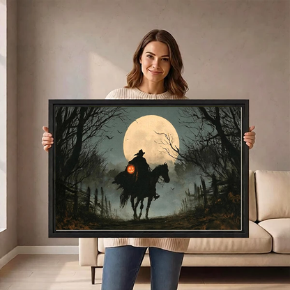 Gothic Moonlit Witch Rider artwork held in a black frame by a woman beside a cream sofa.