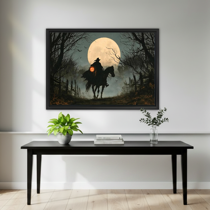 Gothic Moonlit Witch Rider artwork in a black frame above a black console with plants.