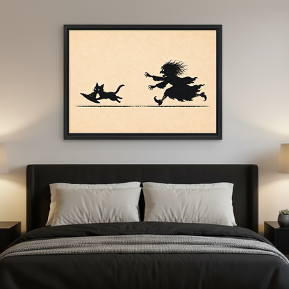 Funny Witch Cat Chase artwork in a black frame above a bed with dark headboard.