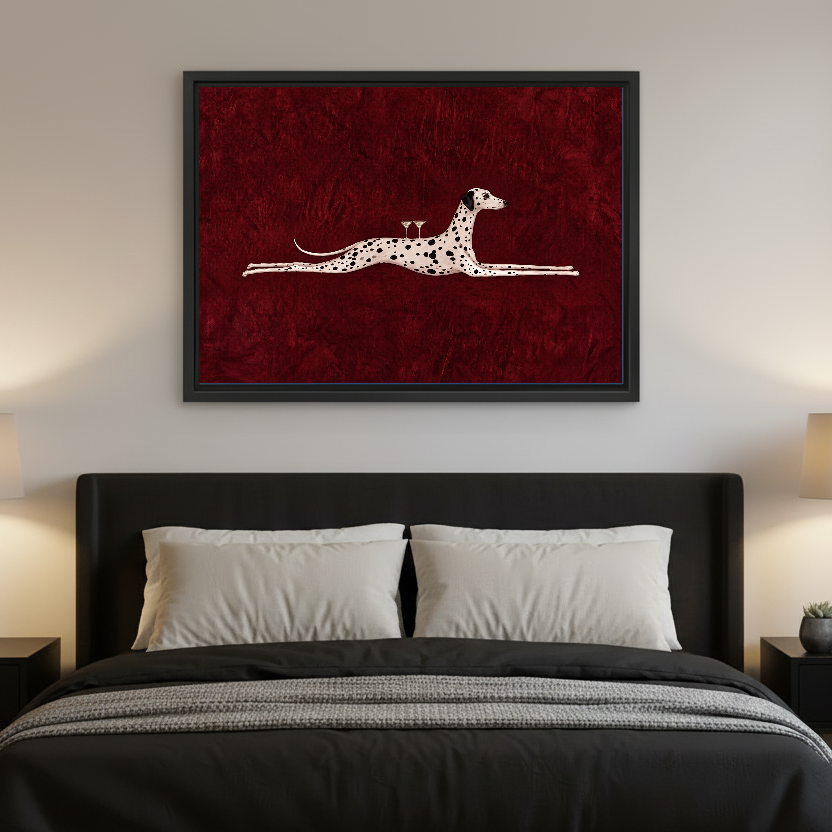 Surreal Dalmatian Cocktail artwork in a black frame above a bed with dark headboard.