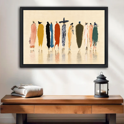 Whimsical Fashion Figures artwork in a black frame above a wooden table and lantern.