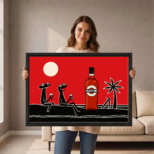 Retro Cocktail Frogs artwork held in a black frame by a woman beside a cream sofa.