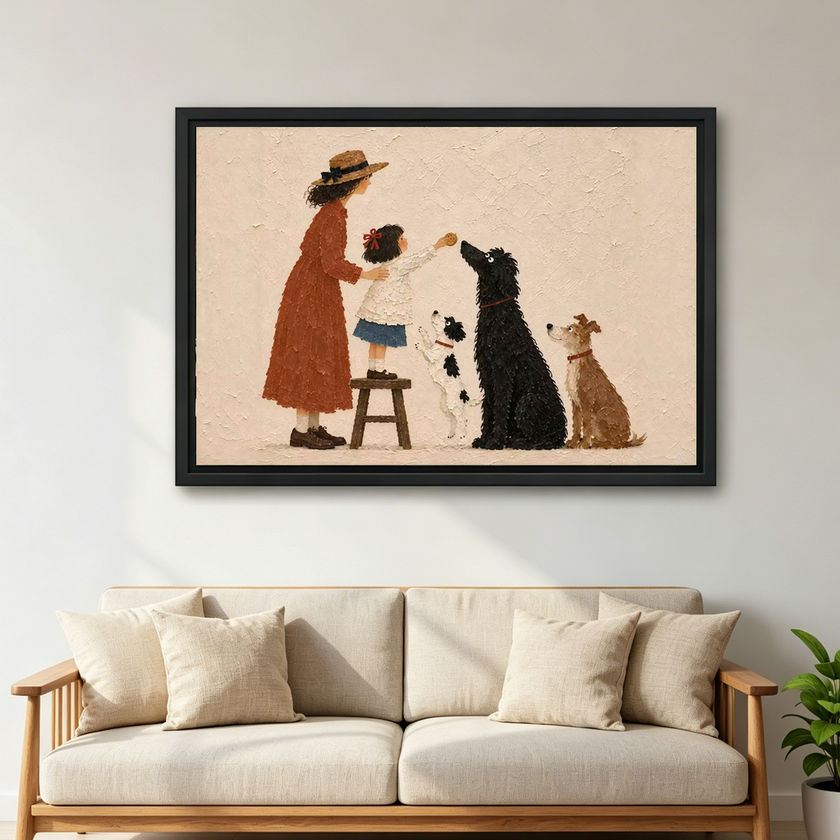 Mother Child Dogs artwork in a black frame above a cream sofa with wooden arms.