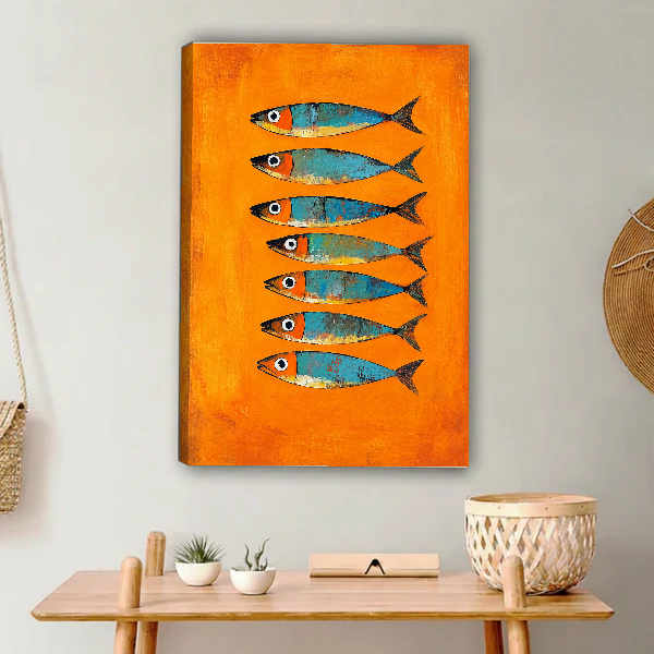 Orange Turquoise Sardines artwork as unframed canvas above a wooden console beside woven accents.