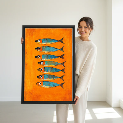 Orange Turquoise Sardines artwork held by a woman in a bright neutral room.