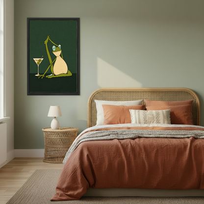 Funny Yoga Martini Frog artwork in a black frame above a bed with rust bedding.
