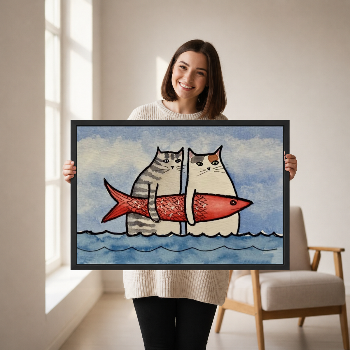 Funny Cats Red Fish artwork held by a woman in a softly lit neutral living room.