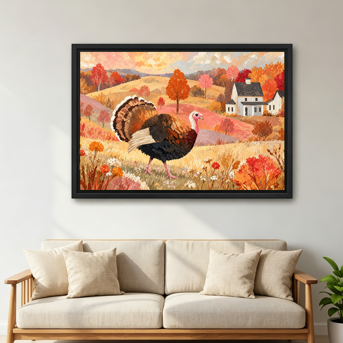 Autumn Turkey Farmhouse artwork in a black frame above a cream sofa with wooden arms.