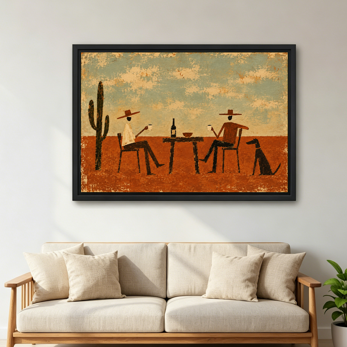 Rustic Cowboy Drinking Friends artwork in a black frame above a cream sofa with wooden arms.