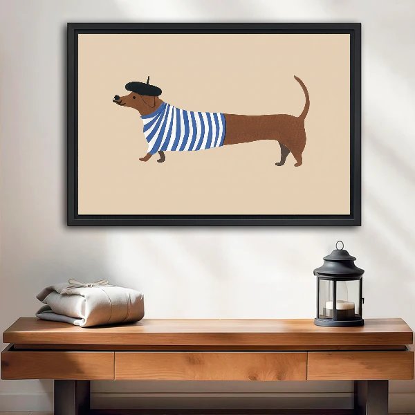 French Striped Dachshund artwork in a black frame above a wooden table and lantern.