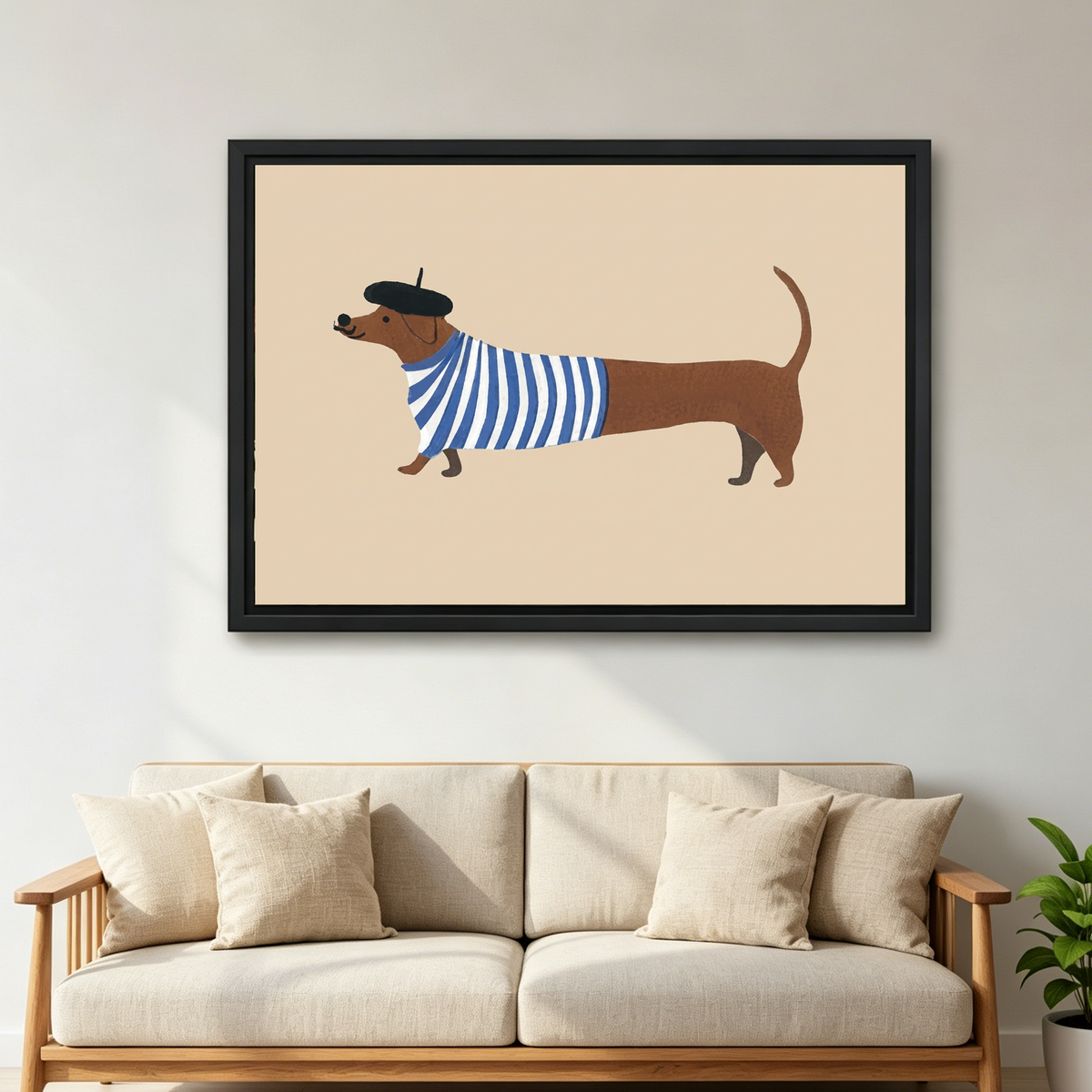 French Striped Dachshund artwork in a black frame above a cream sofa with wooden arms.