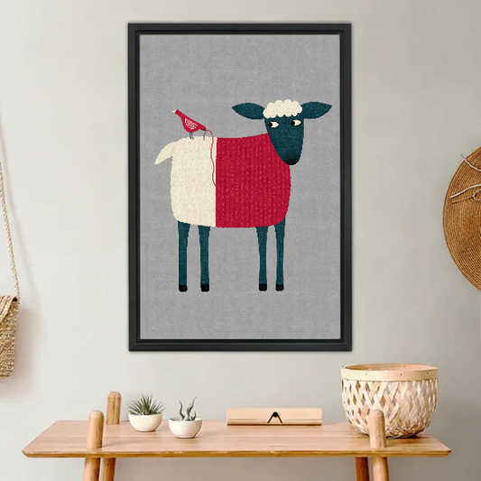 Folk Sheep Red Bird artwork in a black frame above a warm wooden console.