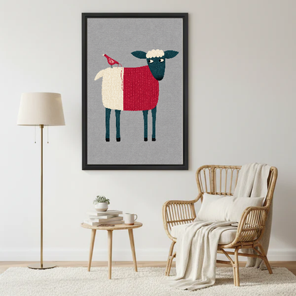 Folk Sheep Red Bird artwork in a black frame beside a lamp and pale rattan chair.