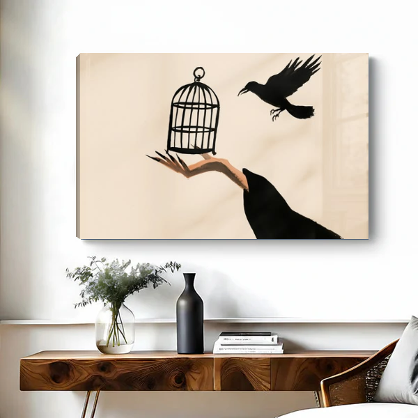 Raven Hand Birdcage artwork as unframed canvas above a wooden desk with black vase.