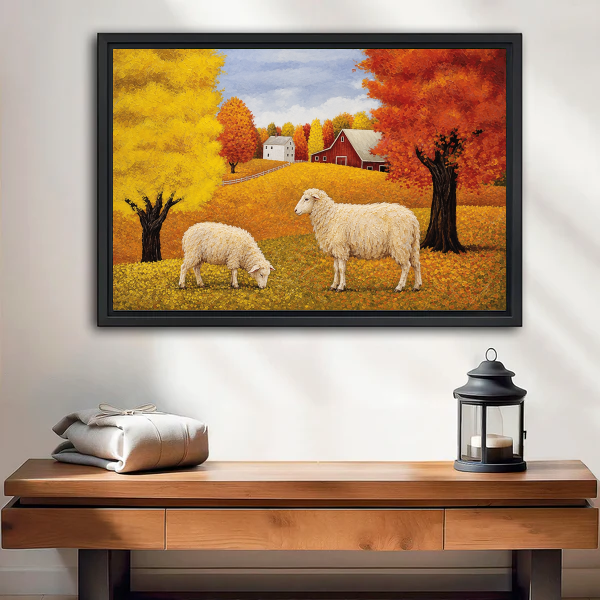 Golden Autumn Sheep Farm artwork in a black frame above a wooden table and lantern.