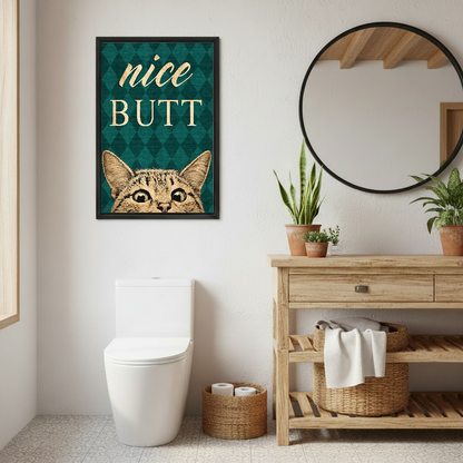 Nice Butt Bathroom Cat artwork in a black frame beside a wooden vanity and round mirror.